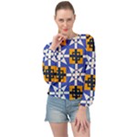 Shapes on a blue background                                                          Banded Bottom Chiffon Top