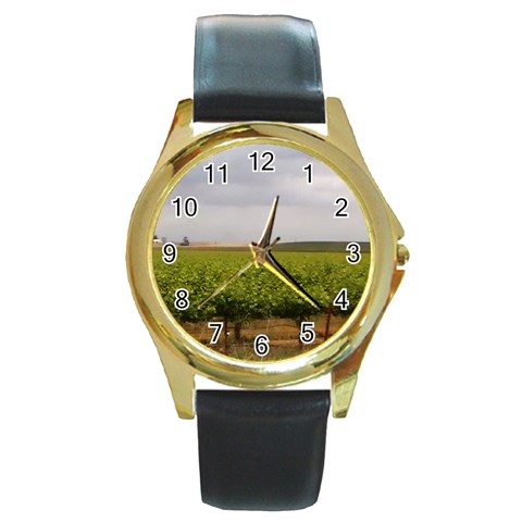 Vinyard Beneath A Cloudy Sky Round Gold Metal Watch from ArtsNow.com Front